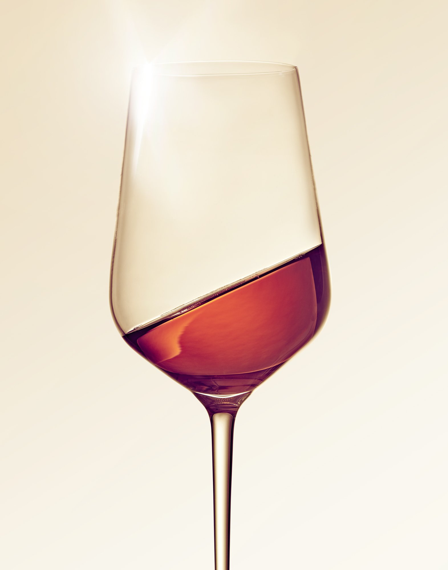 red wine swirl in modern wine glass with a sparkle.jpg