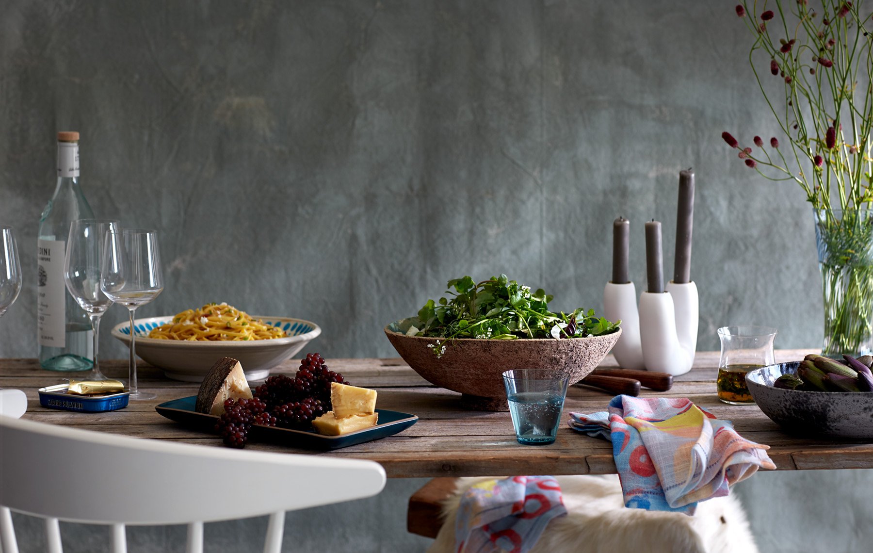 quirky styling for a tabletop dinner of organic salad, cheese plate, pasta, tinned fish.jpg