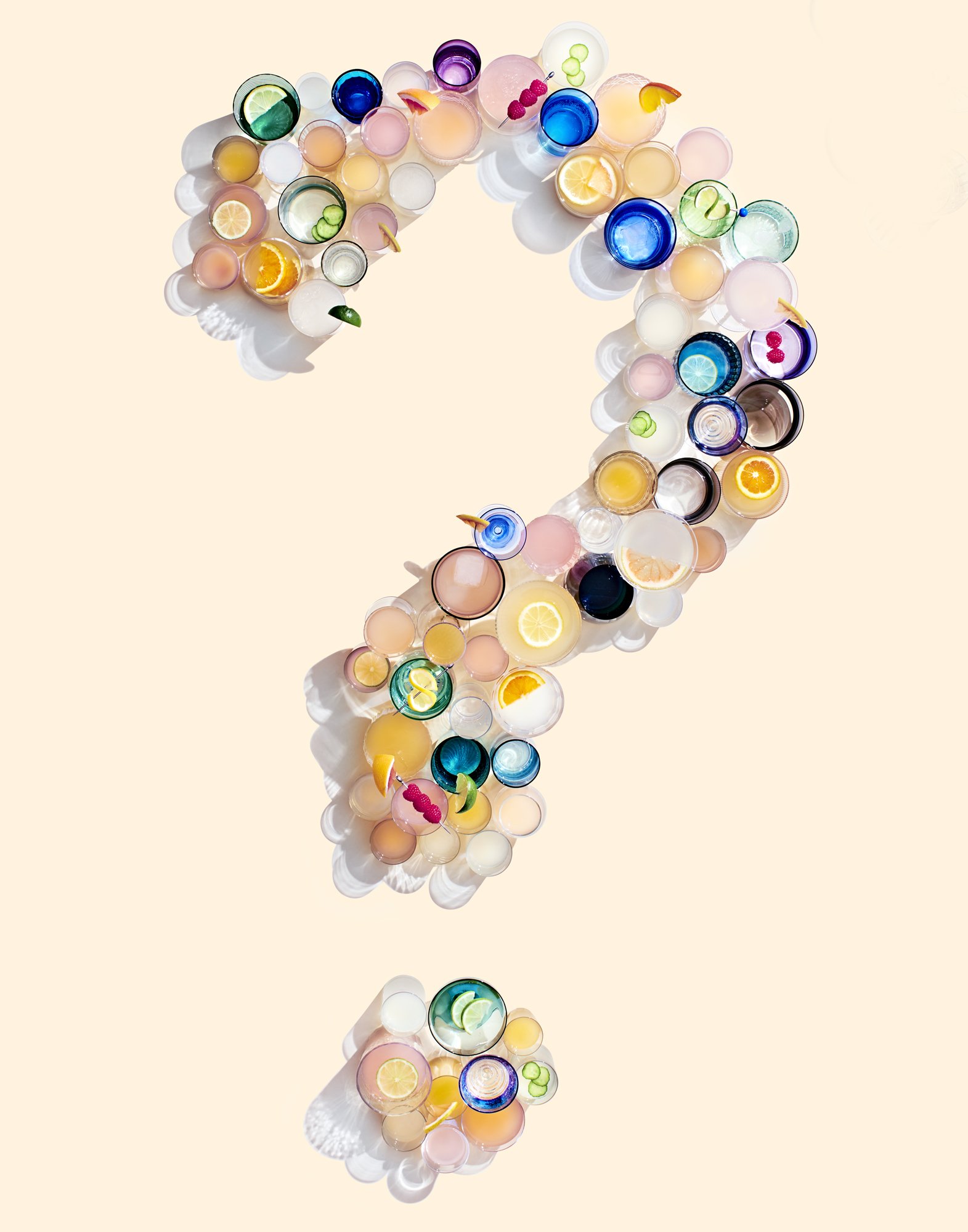 drinks in multi colored mix of glassware in the shape of a question mark.jpg