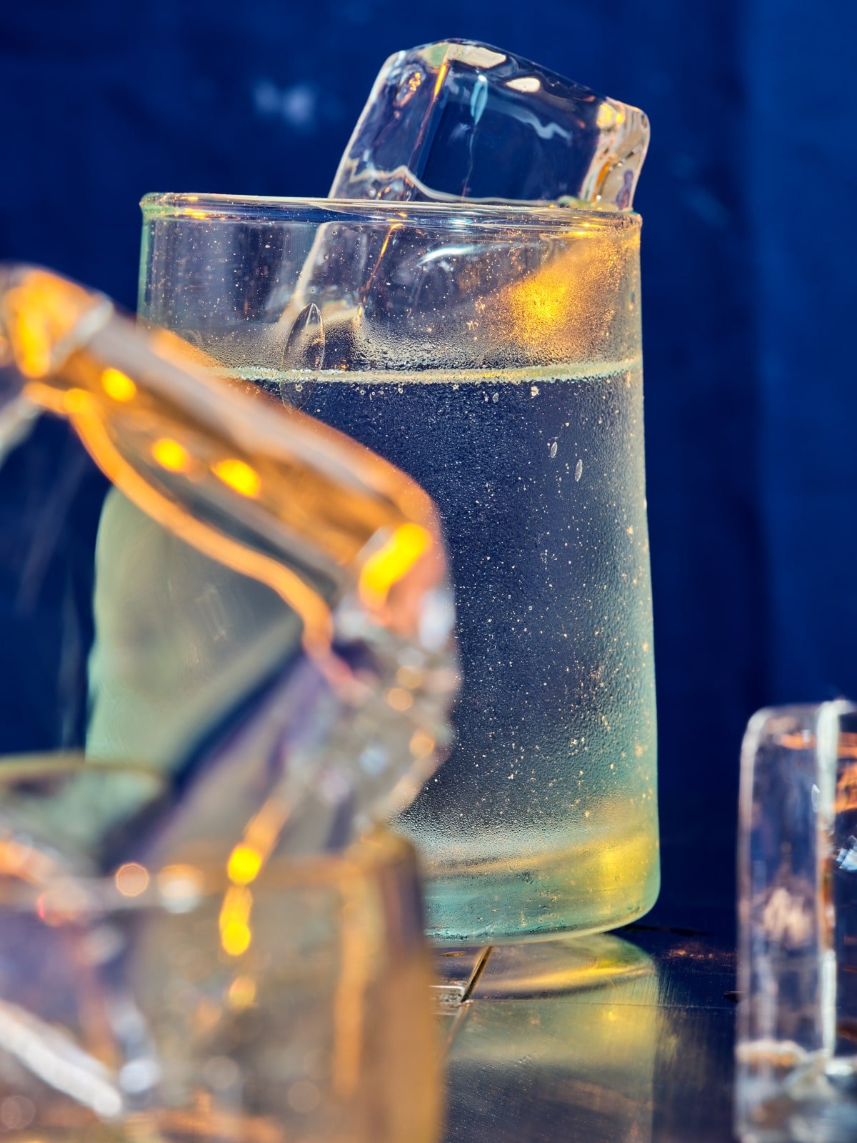 close up of seltzer in handmade glass with fancy ice.jpg
