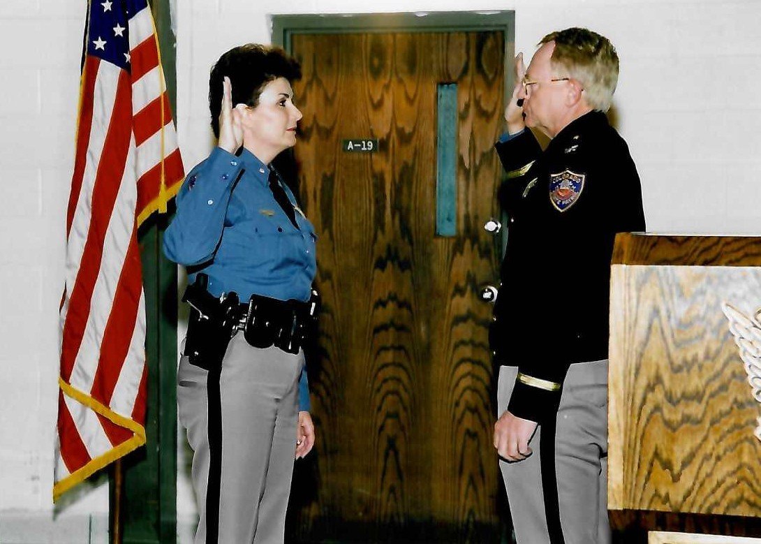 Chief Lonnie Westphal swears me in as 1st Woman Major October 1998