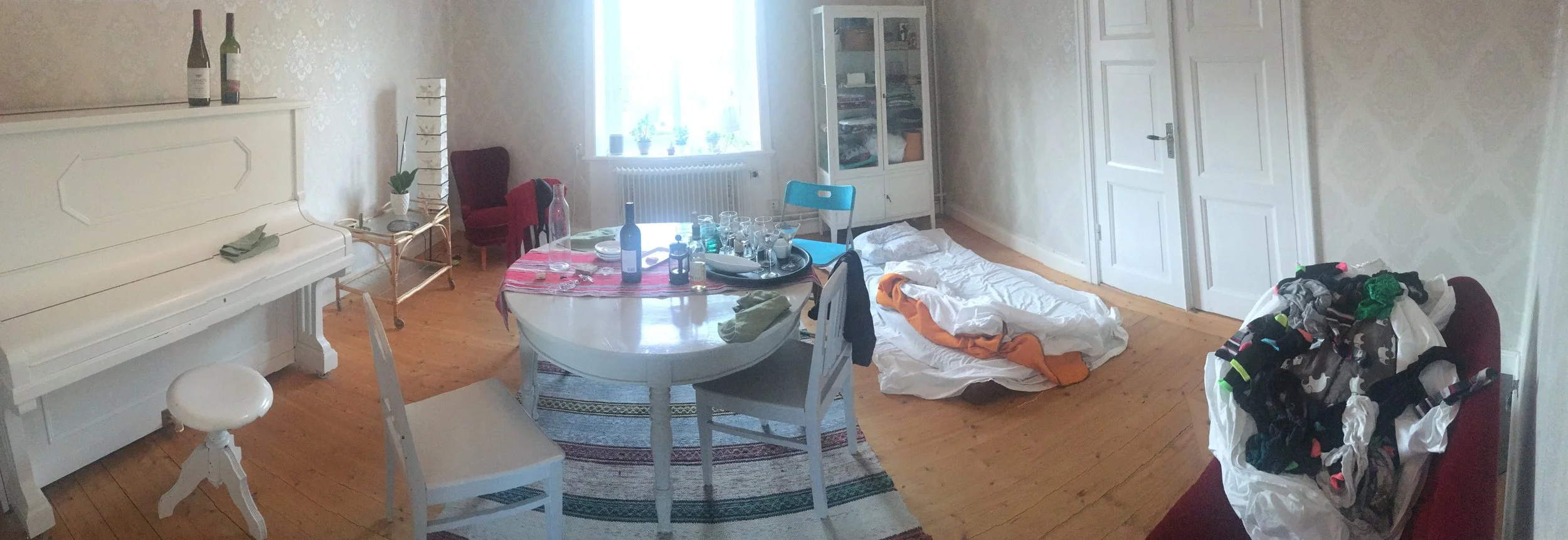 Woke up to this in the morning. From left to right: the piano, remnants of yesterday's dinner, my "bed", the laundry that I have to fold.