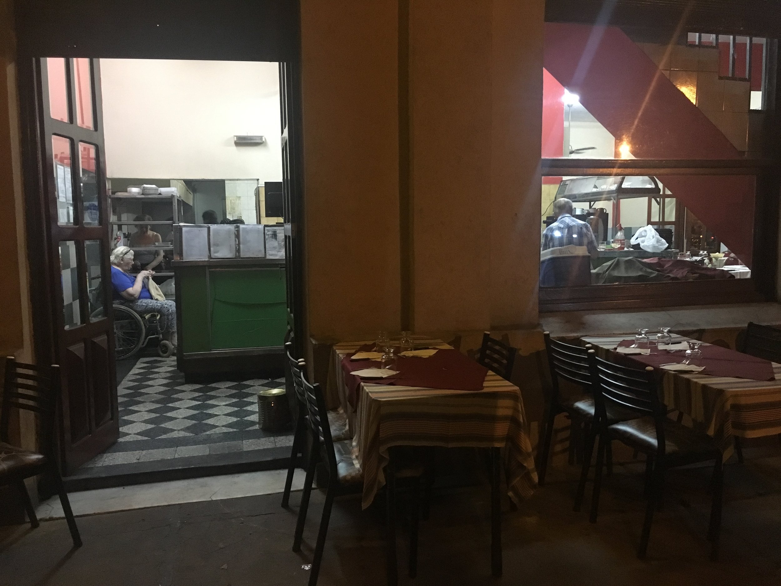 Grandma knitting in the kitchen
