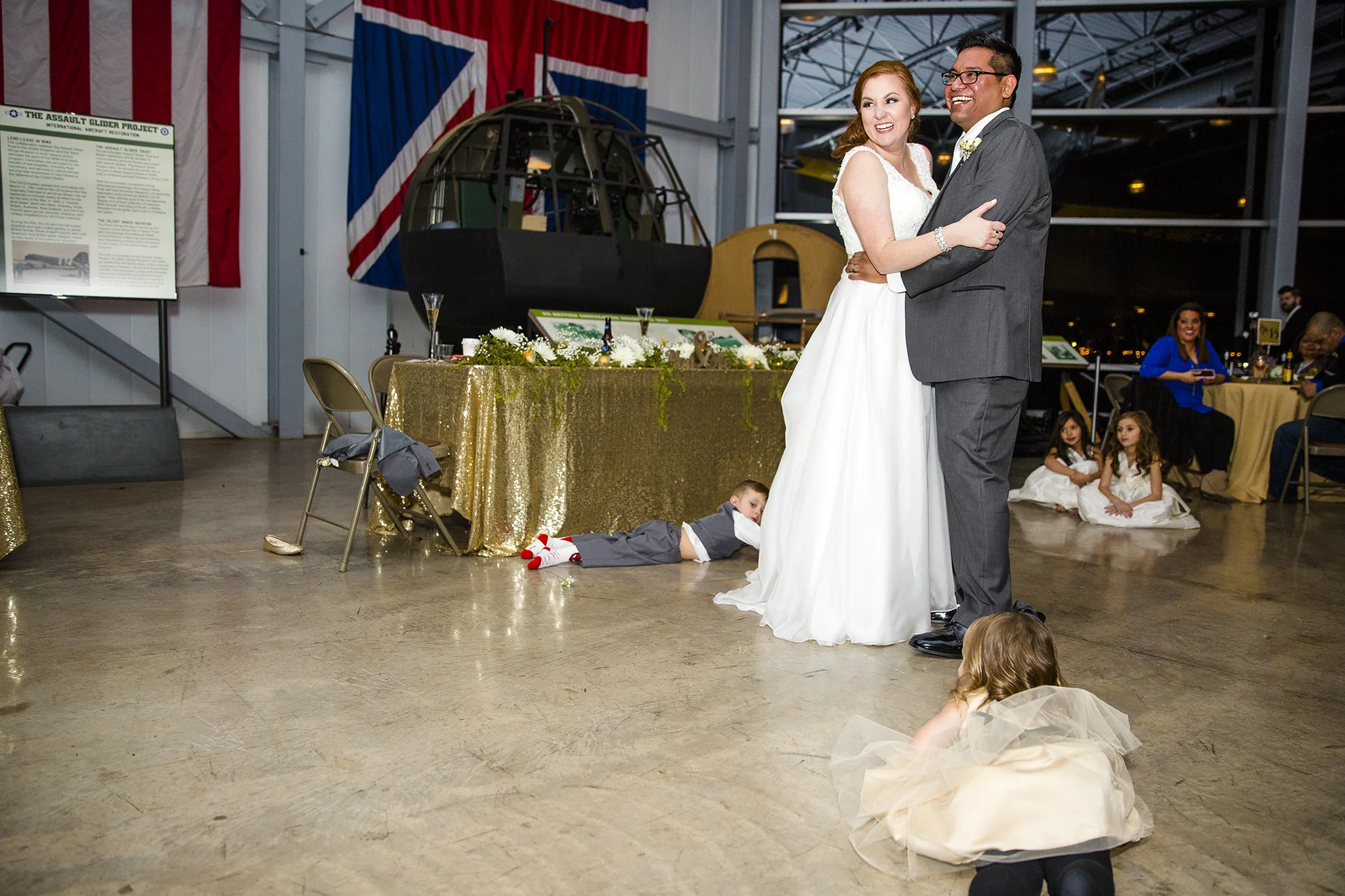 first dance, bride and groom, wedding reception, silent wings museum, giant windows