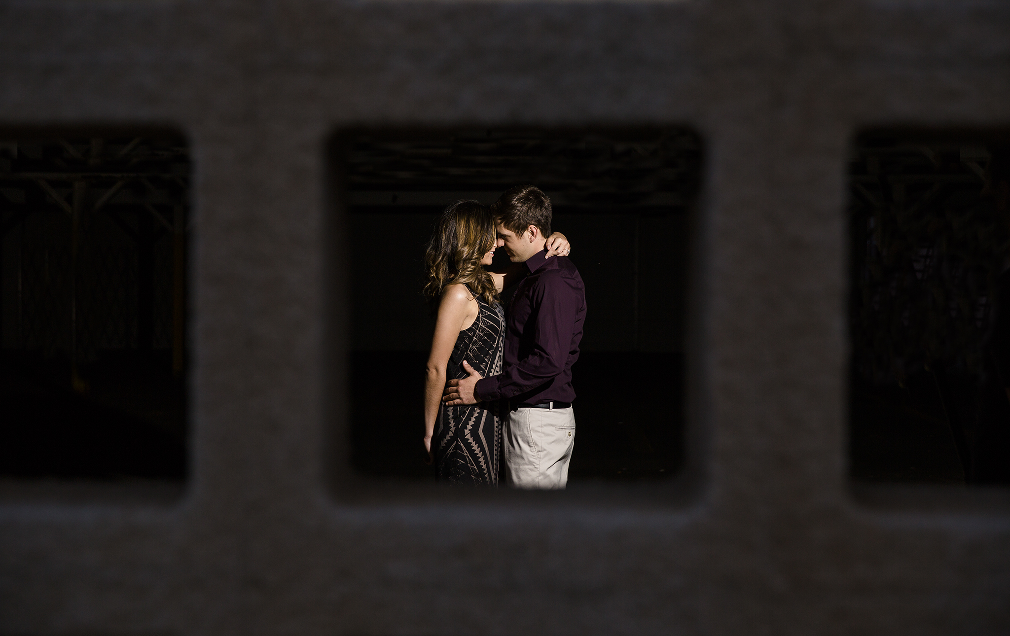 creative framing, shooting through objects, apertures, parking garage architecture, edgy, dramatic, romantic, sexy, kiss me in the dark