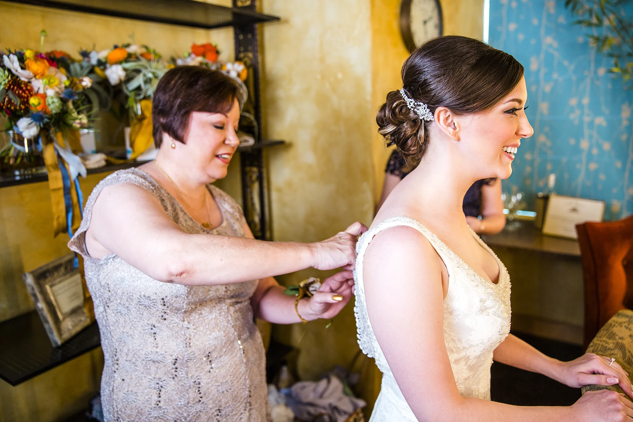 Bride getting ready, putting on the dress