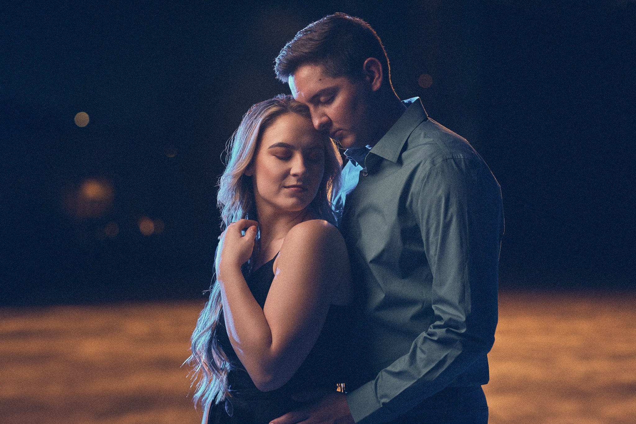 hobbs new mexico couple poses at night for engagement photos