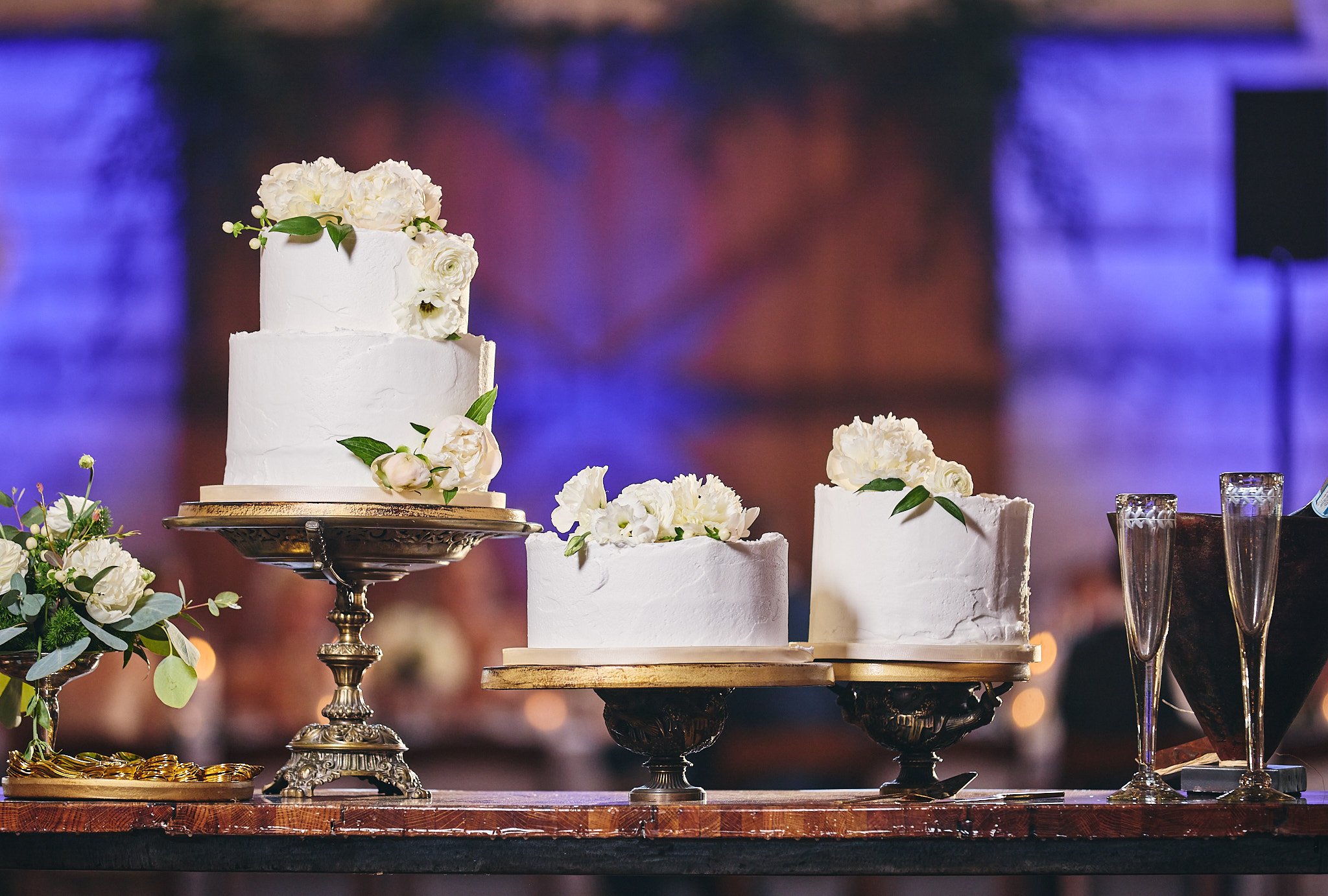 Three Wedding cakes at wedding reception