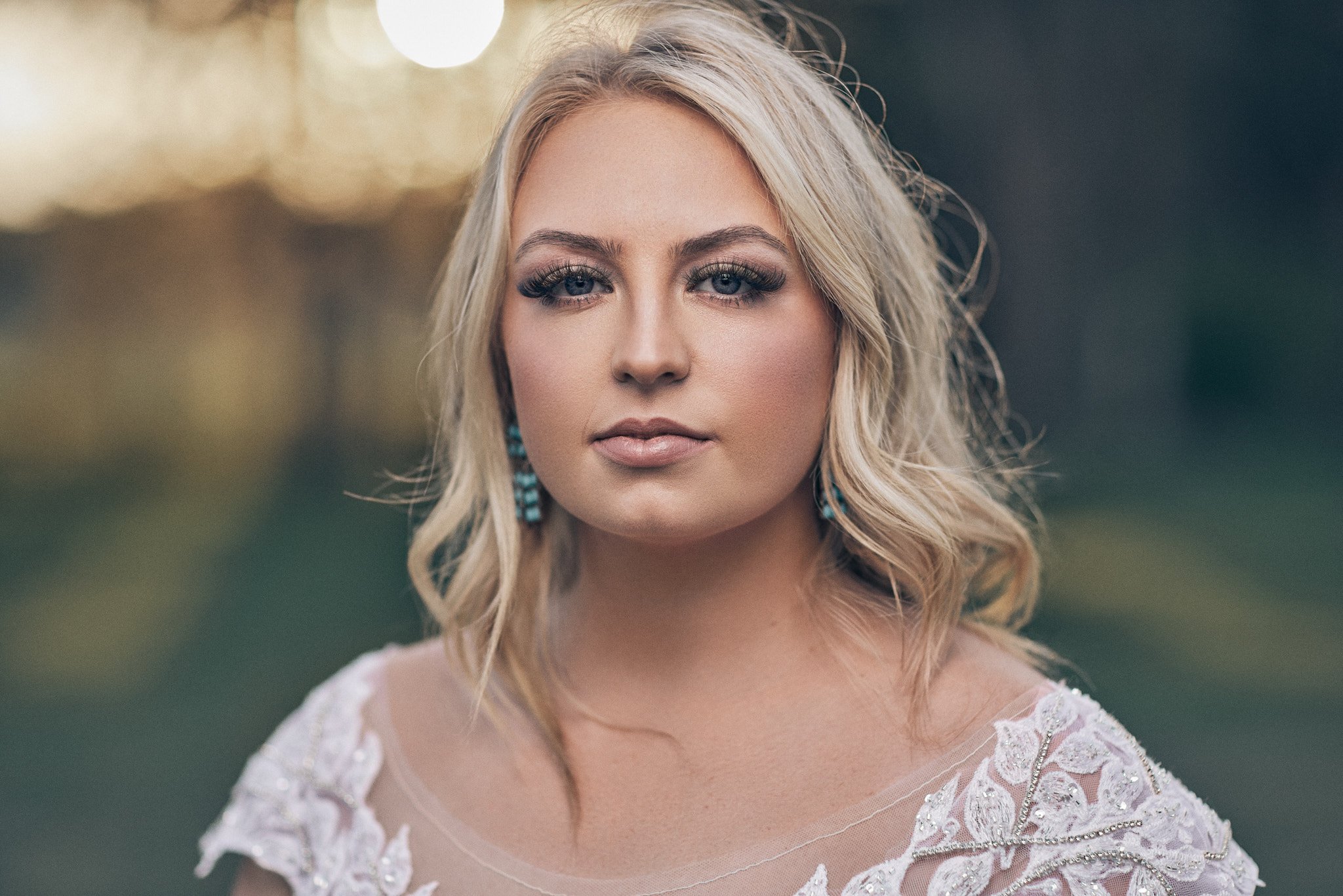 bride looks into the camera during her bridal portrait session