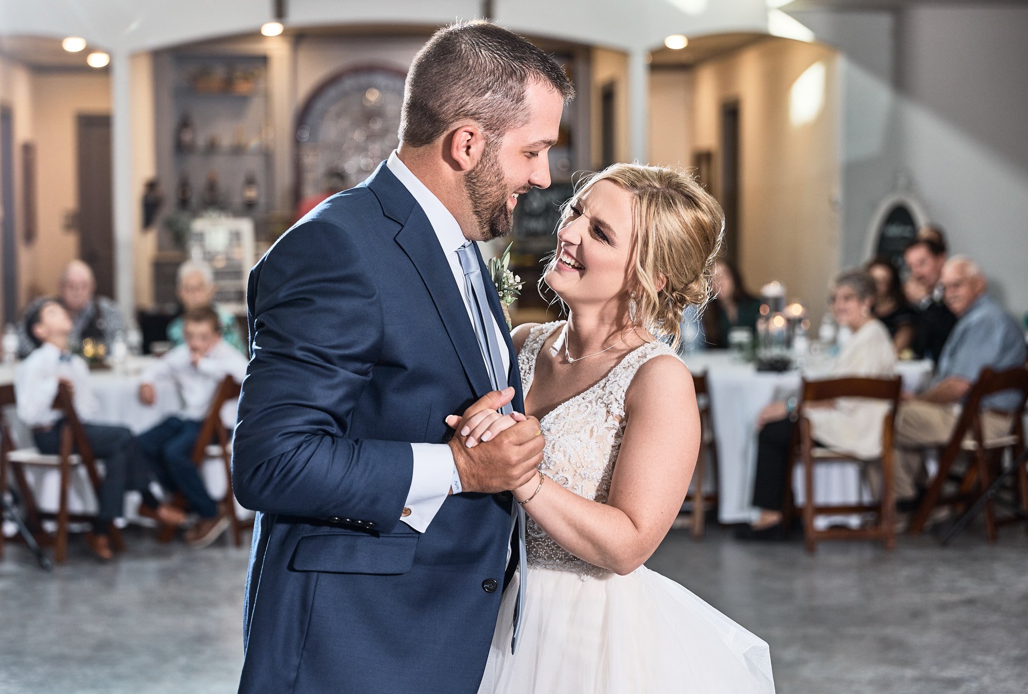 couple smile during their first dance