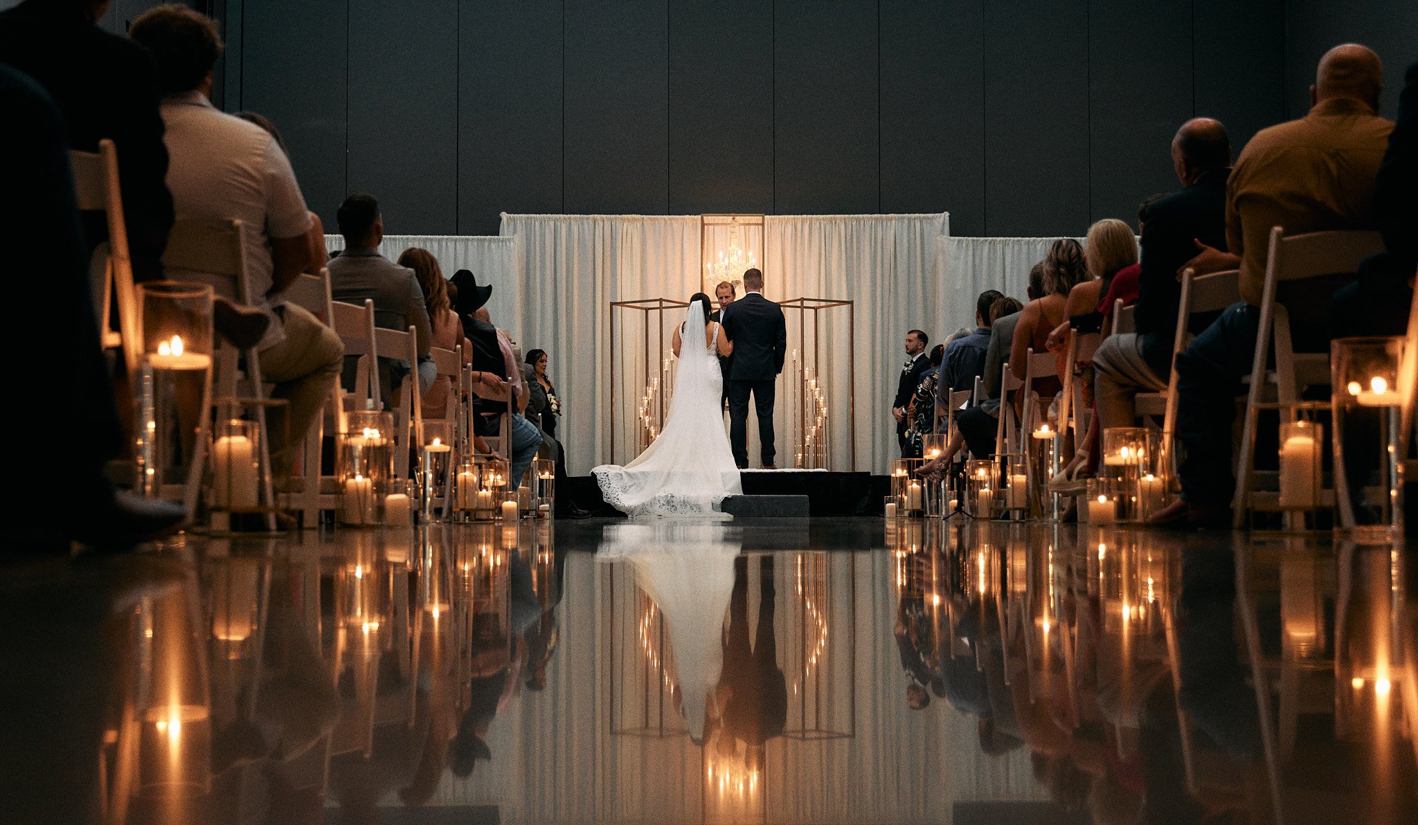 couple stands at the alter during their wedding ceremony