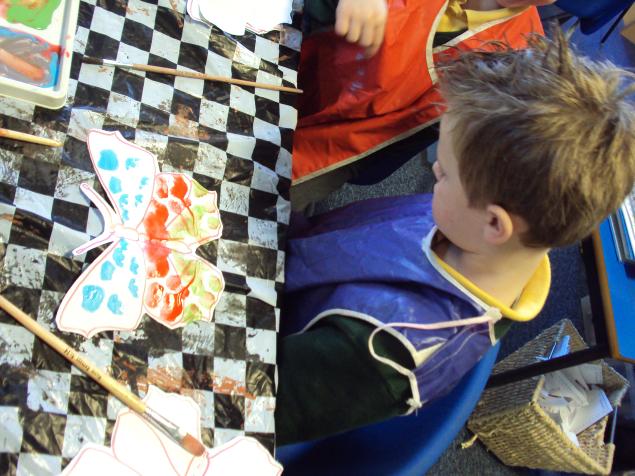  In maths, we have been learning about symmetry.  We painted one side of the butterfly, then folded it so it was symmetrical on the other side. 