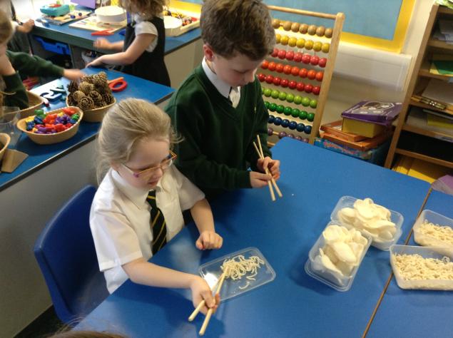  We tried different Chinese foods using chop sticks. 