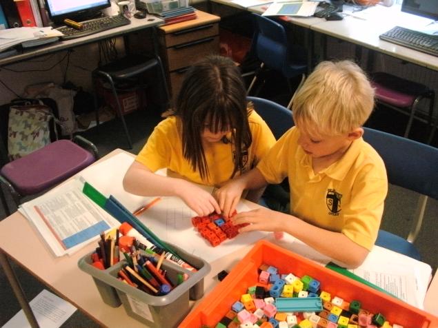 Niamh and Lucas investigate the least amount of moves needed to get the blue cube from one corner to the other. They needed to be logical and methodical!