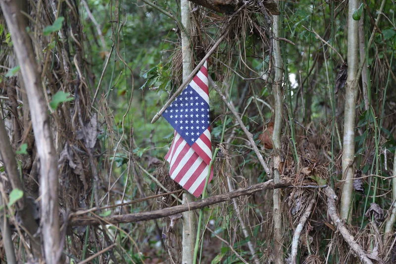 Recovering Caskets from a Stream after Historic Flood