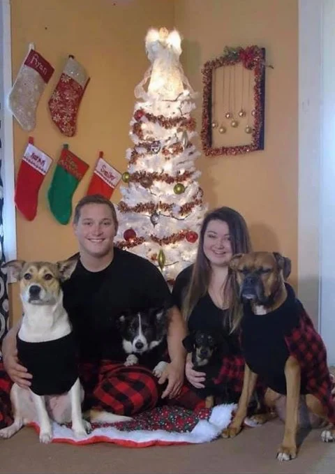 Felicia Woodall, Ryan Pence, and their dogs. Picture courtesy Amy Sanderson