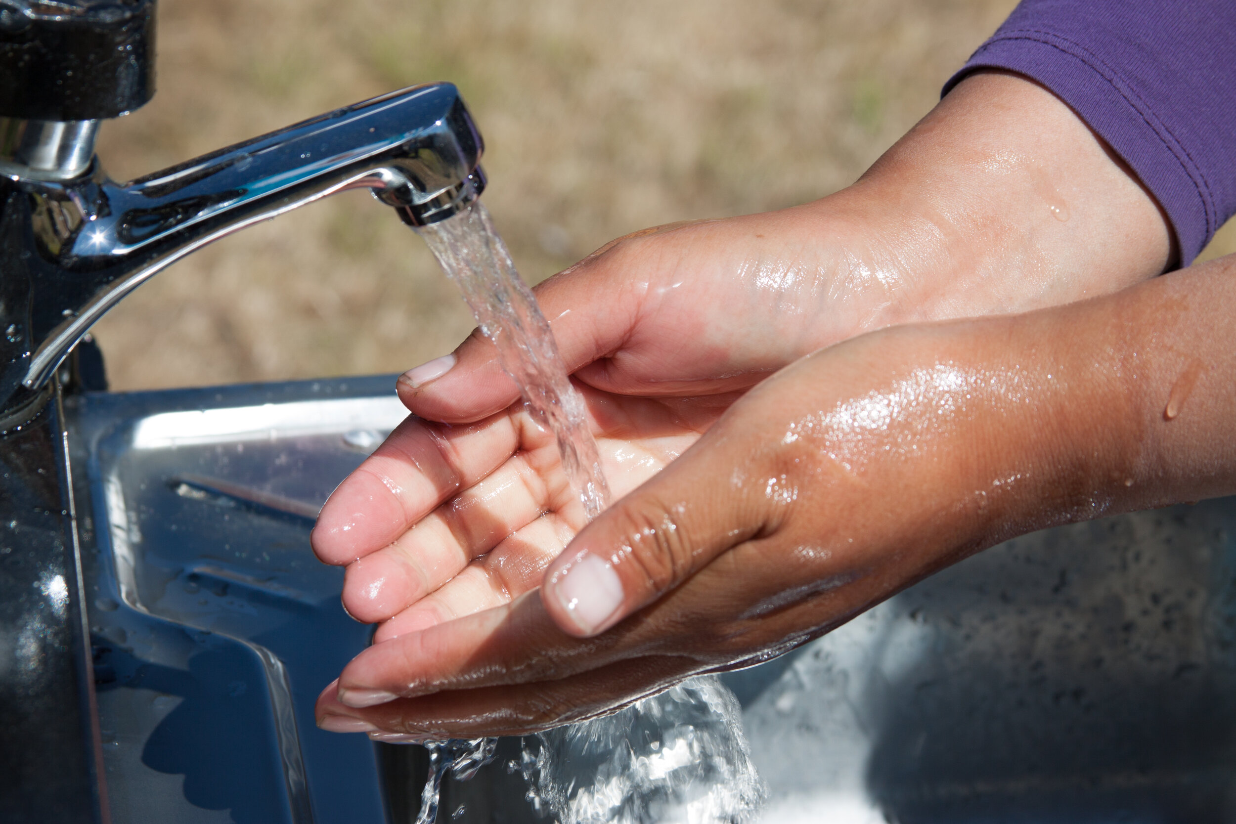 Clean water flowing from one of the community’s new, handwashing stations 