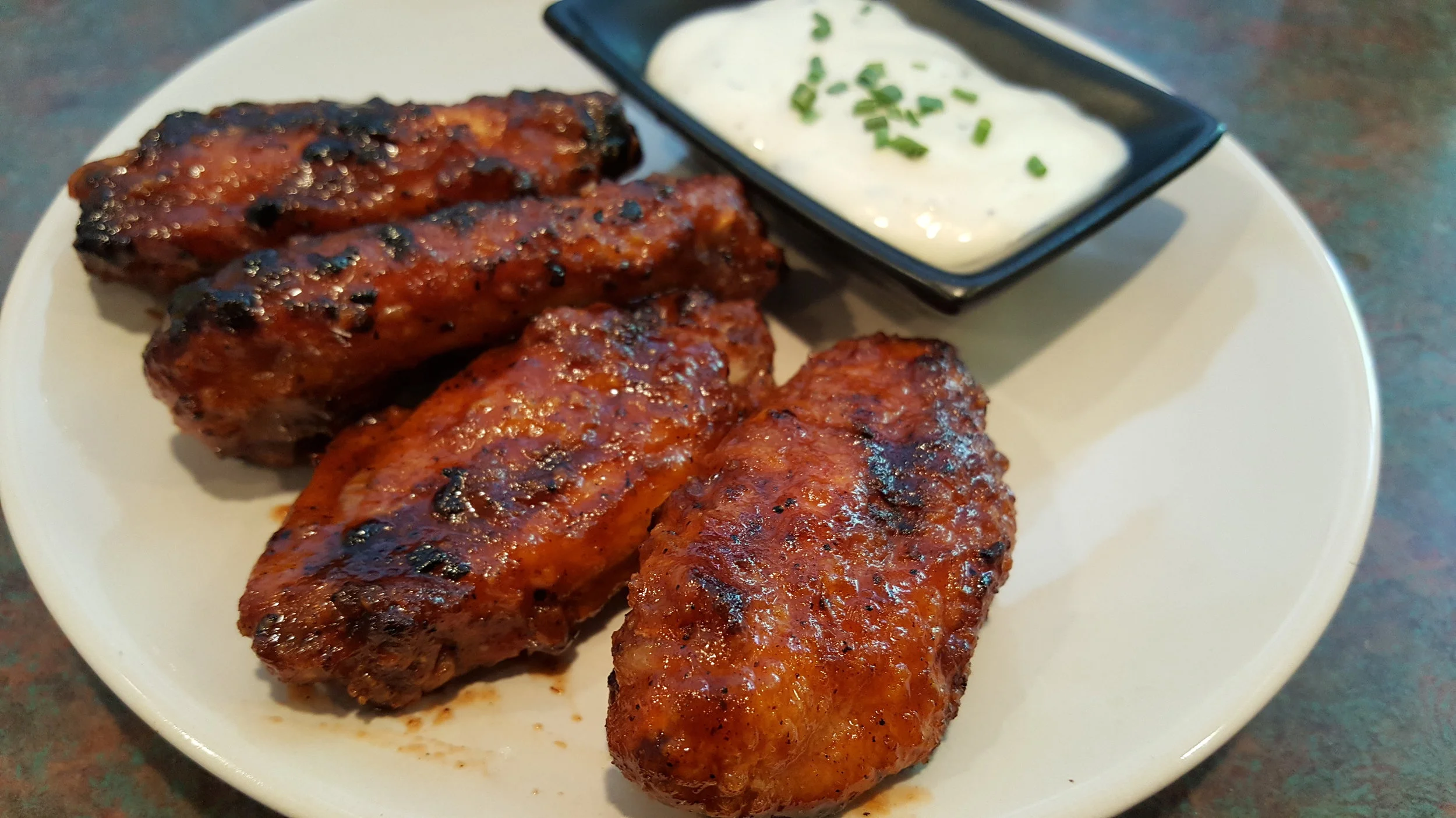 Equal parts Sriracha & Honey for a wing delivering hefty doses of both heat and sweet.