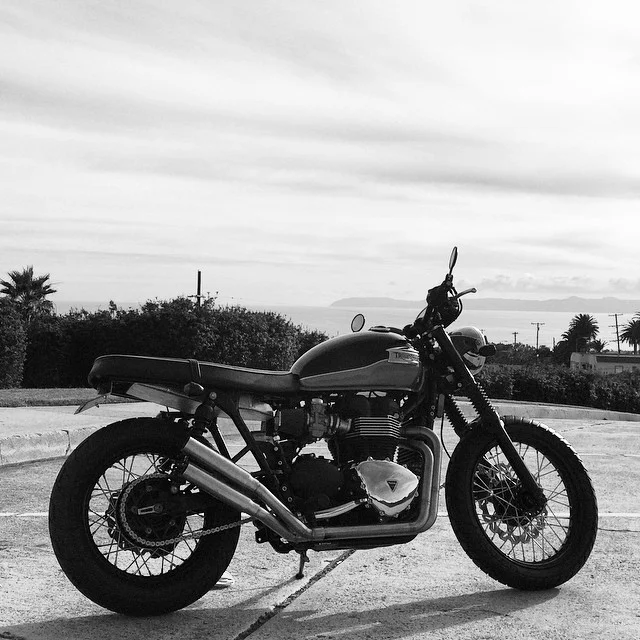 phase 3 = battery box kit, license plate bracket by Iron Cobras Fabrication , Tracker Bars by Biltwell , and bar end mirrors by Oberon, front and rear brake rotors by Braking, Black powder coated rims and hubs, Avon Distanzia tires.