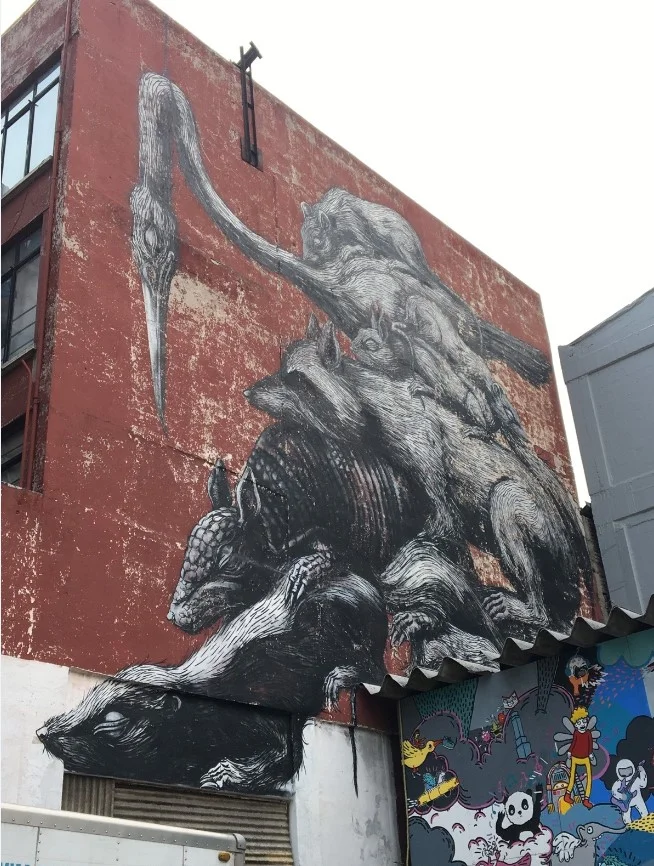 We found our friend ROA’s mural located in the parking lot of the toy store.