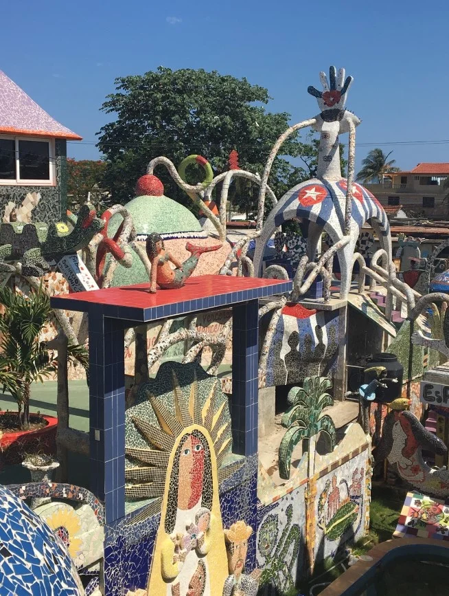 Fusterlandia, the studio, residence and wild kingdom of Jose Rodriguez Fuster. The neighborhood has changed a lot since Fuster came into town over 30 years ago. Inspired by his visit to Europe, had came back to Cuba with plenty of ideas. Roofs, walls, doorways and benches, stretching for blocks around his studio, are adorned with his brightly colored sculptures and mosaics. More than 80 neighbors have allowed Fuster to use their homes as his canvas.