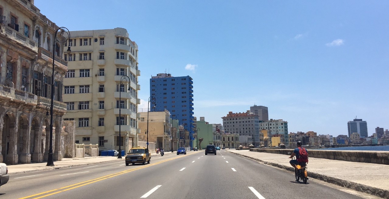 The Malecon is a broad roadway and seawall which stretches for 8 km along the coast in Havana. Here is a daytime view and below is while watching the sunset