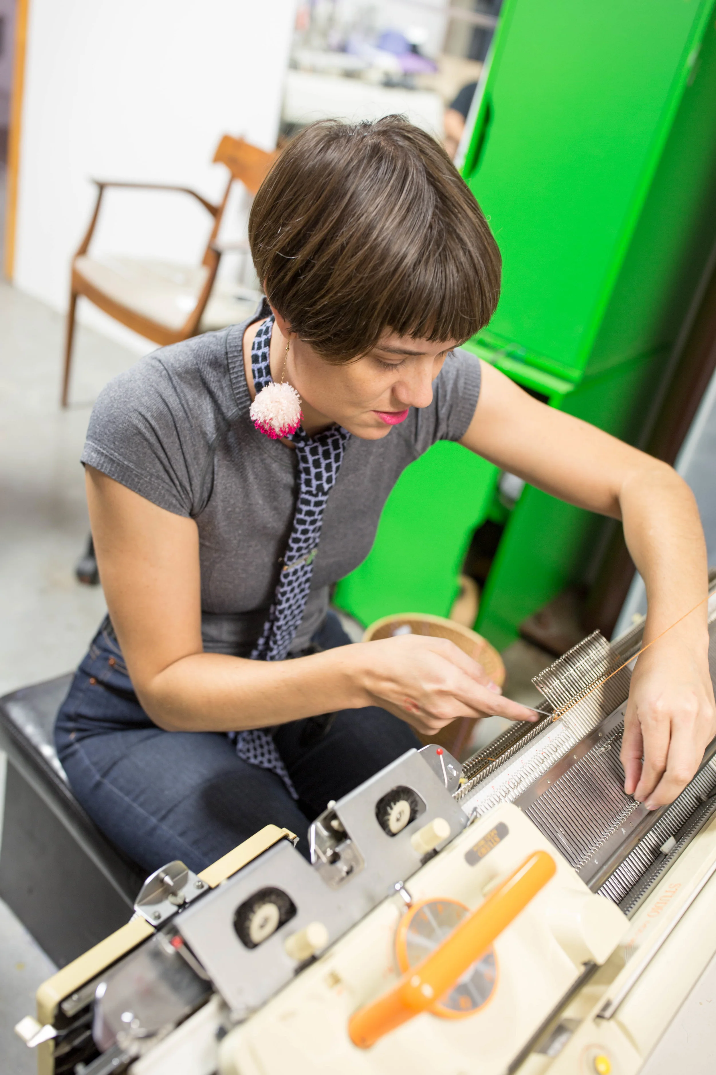 "Here I am doing a demonstration at Art Crawl for Canal Street Studios, showing how I use a punch card “computer” to make my h-town beanies. I am wearing one of my 'cloud ties.'"