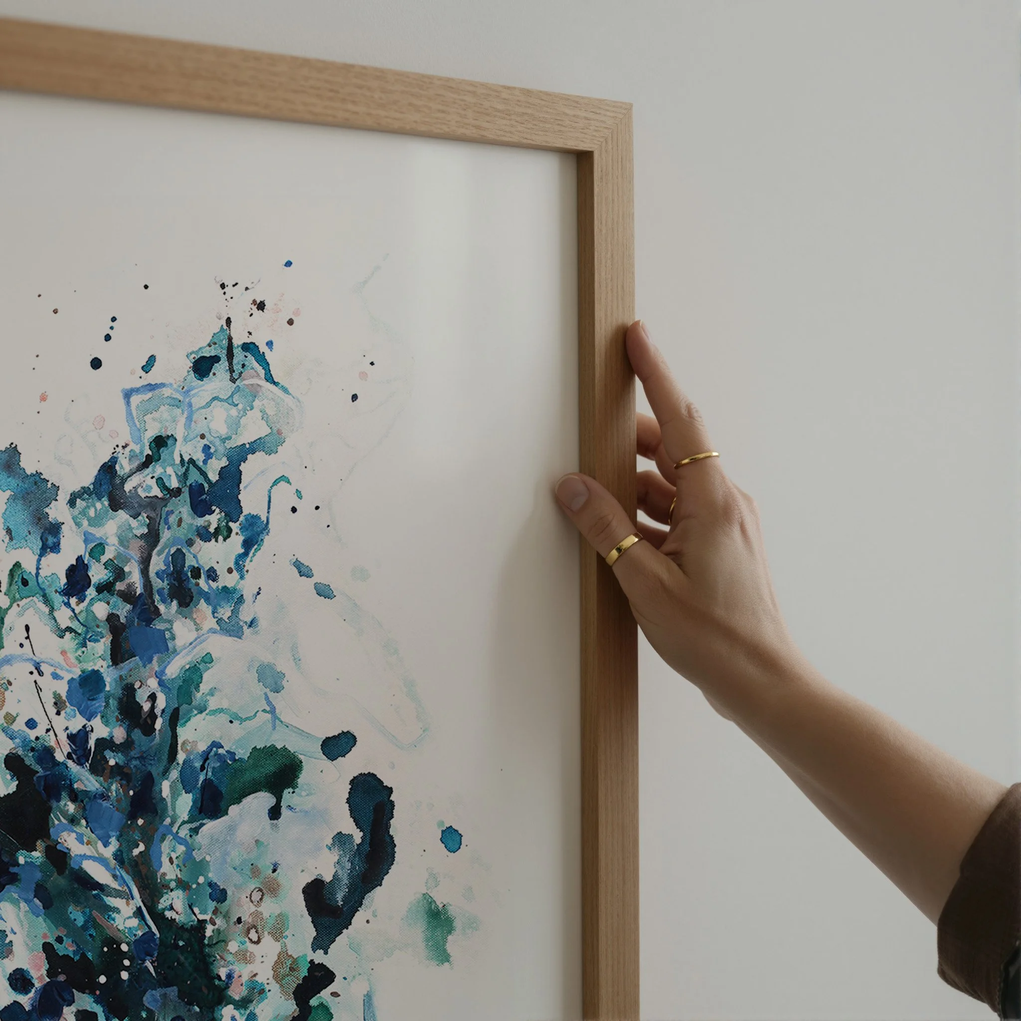 Blue and teal abstract art print with expressive splatter details, modern wall decor with airy white space. Vertical art print by Kendra Castillo