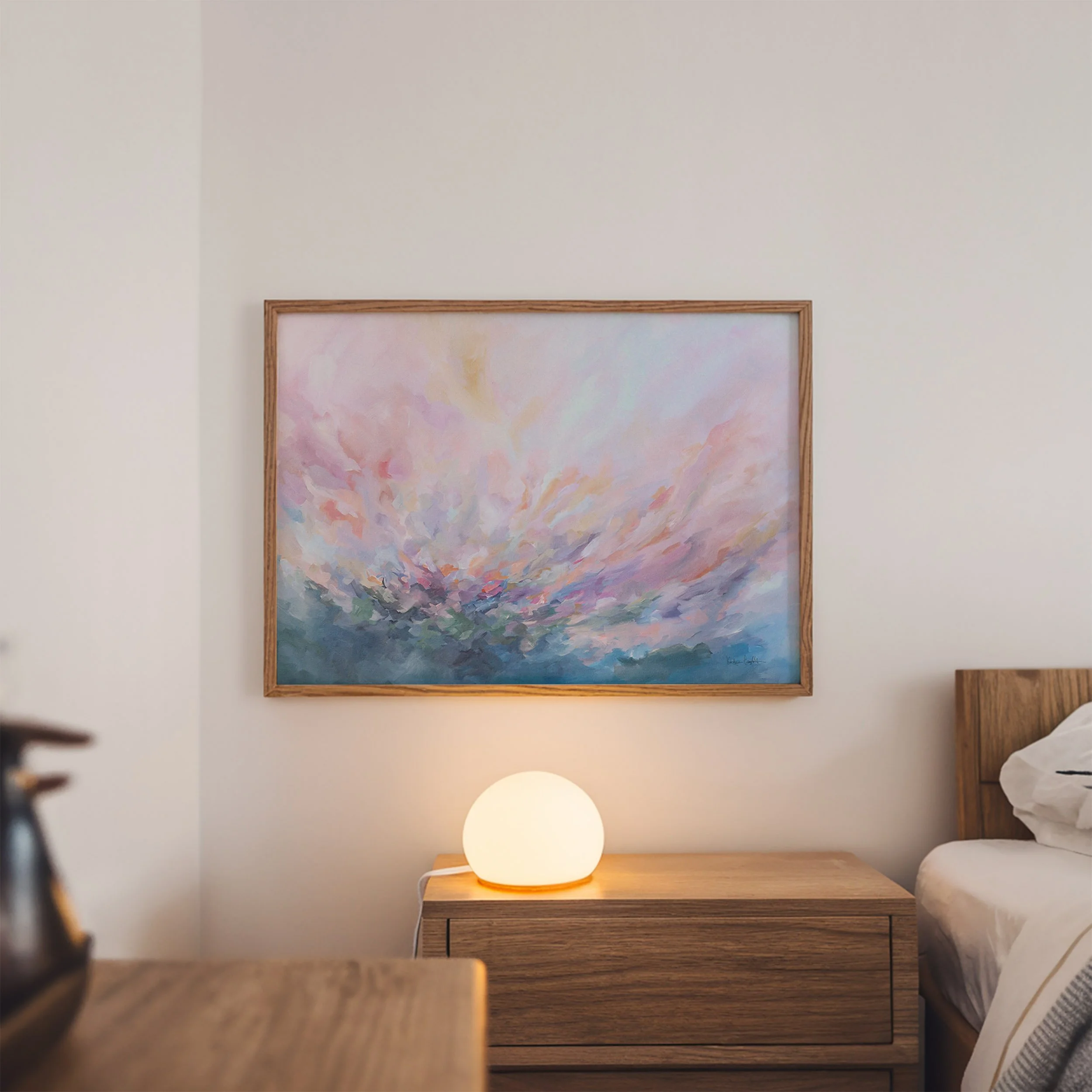 Abstract painting with a burst of pink, purple, and blue colors. The painting has a soft, dreamy feel and is perfect for adding a touch of color to any room. Horizontal art print by Kendra Castillo