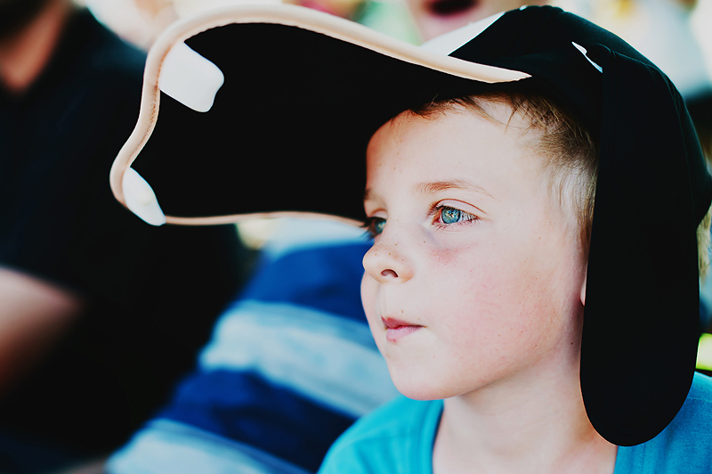 Boy at Disneyland wearing Goofy hat