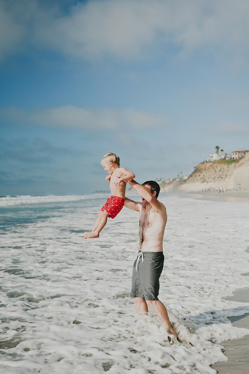 dad and son at beach in california