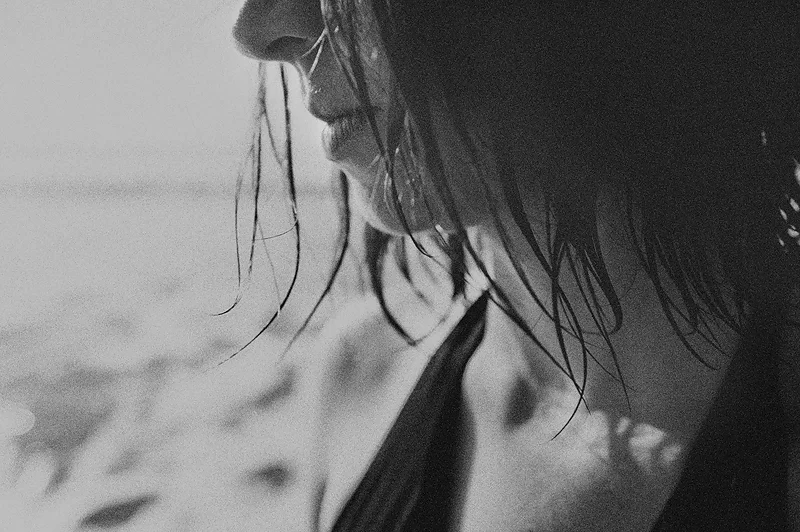 close up of woman's face on the beach