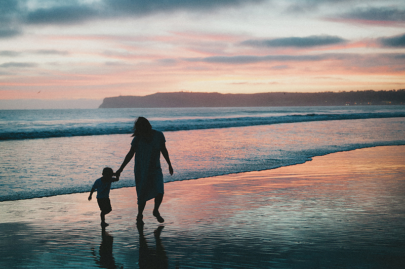 family photos on beach in california at sunset