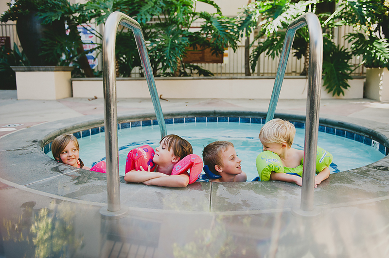 kids in hot tub wearing lifejackets