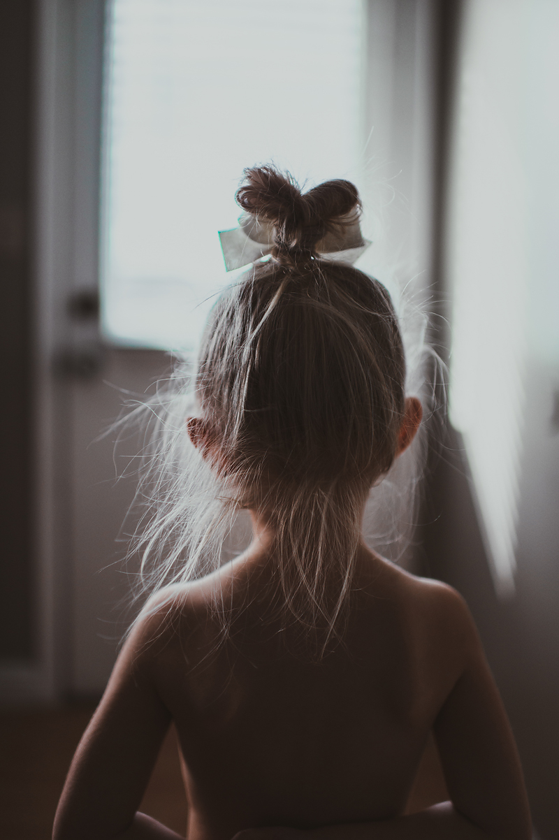 Little girl with messy bun