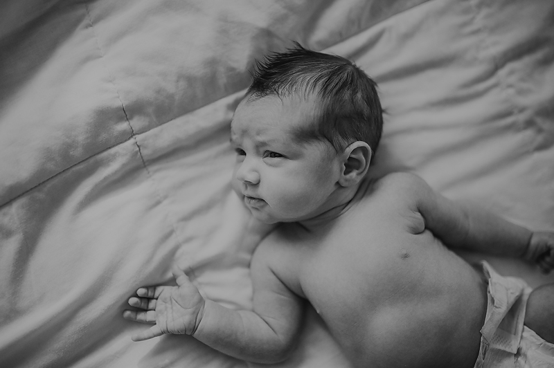 Newborn baby boy awake with eyes open