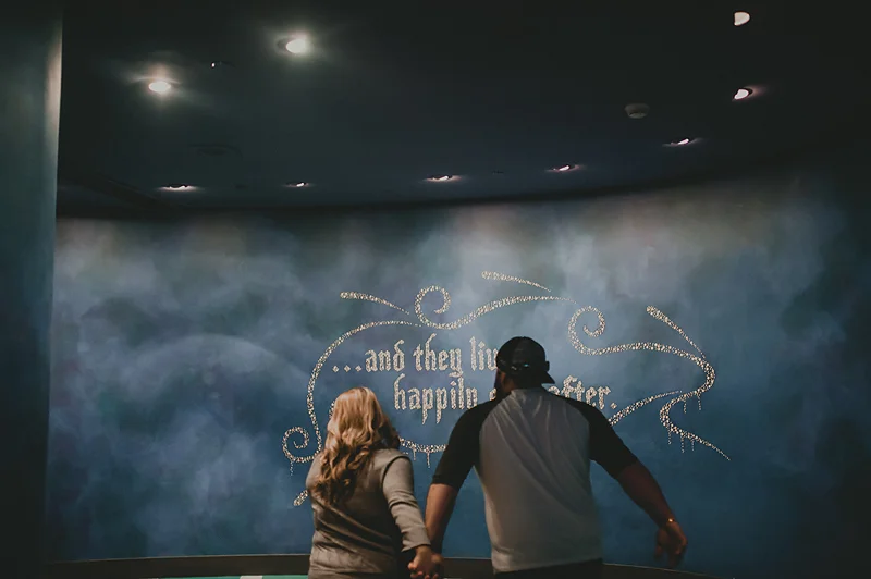 Couple running and playing in animation building at Disneyland california adventure park