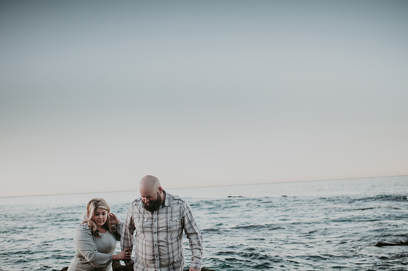 Couple walking together on the beach in California