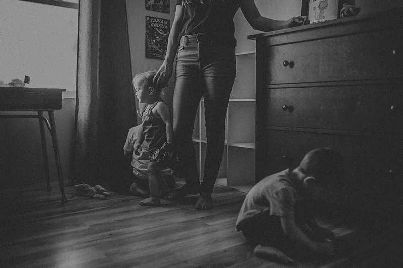 Mom with her children looking out the window