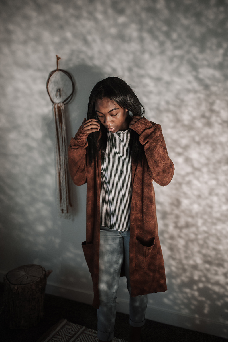 African American girl dancing light and shadow brown sweater dreamcatcher