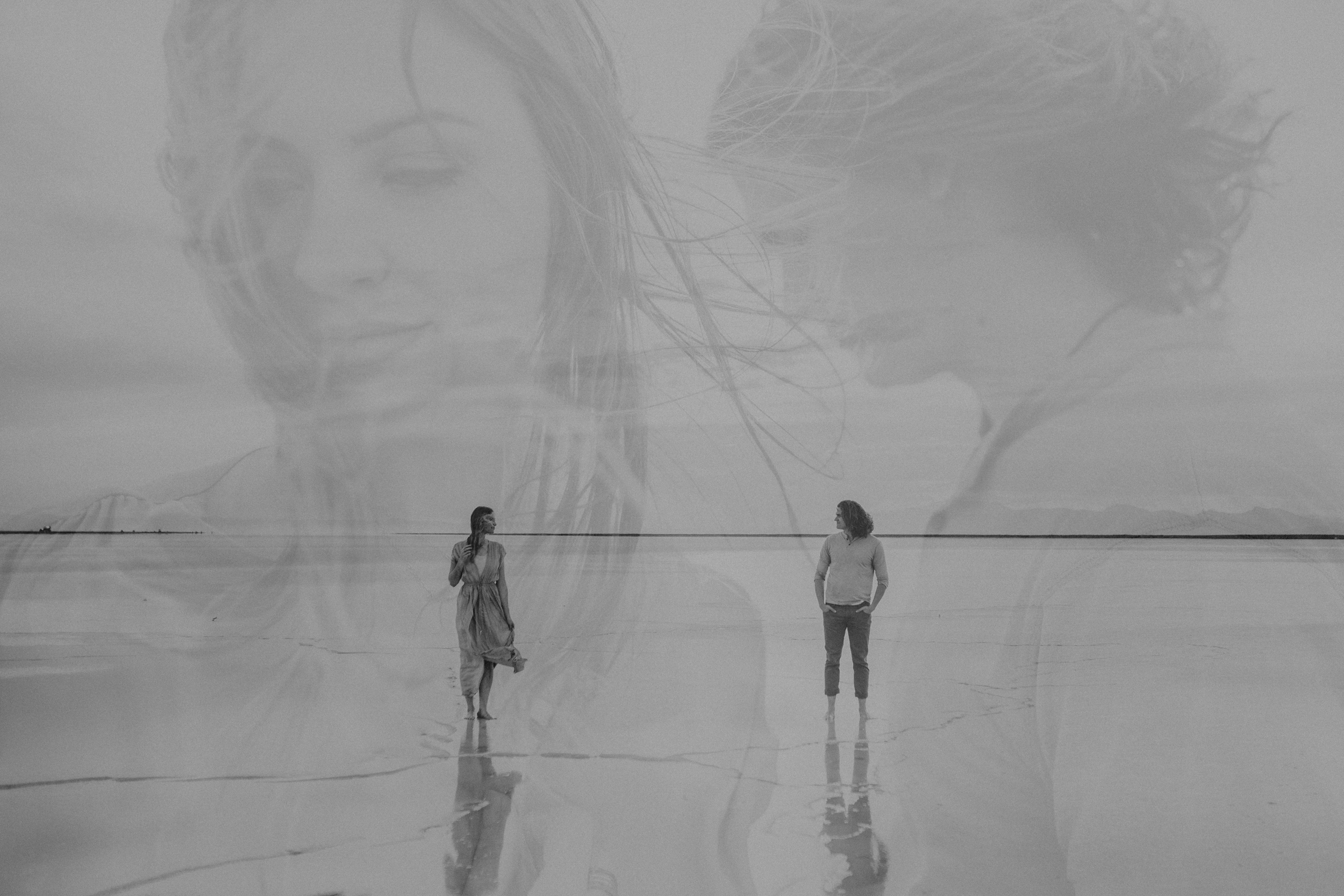 Double exposure of couple at the salt flats