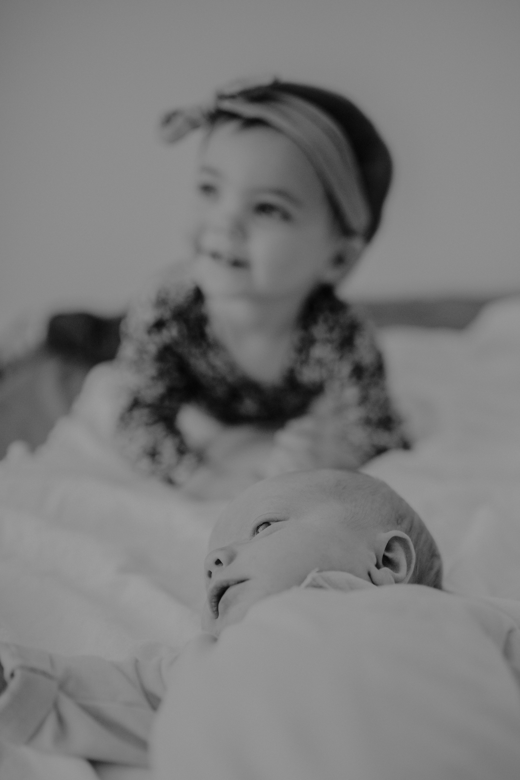 Toddler girl with baby brother