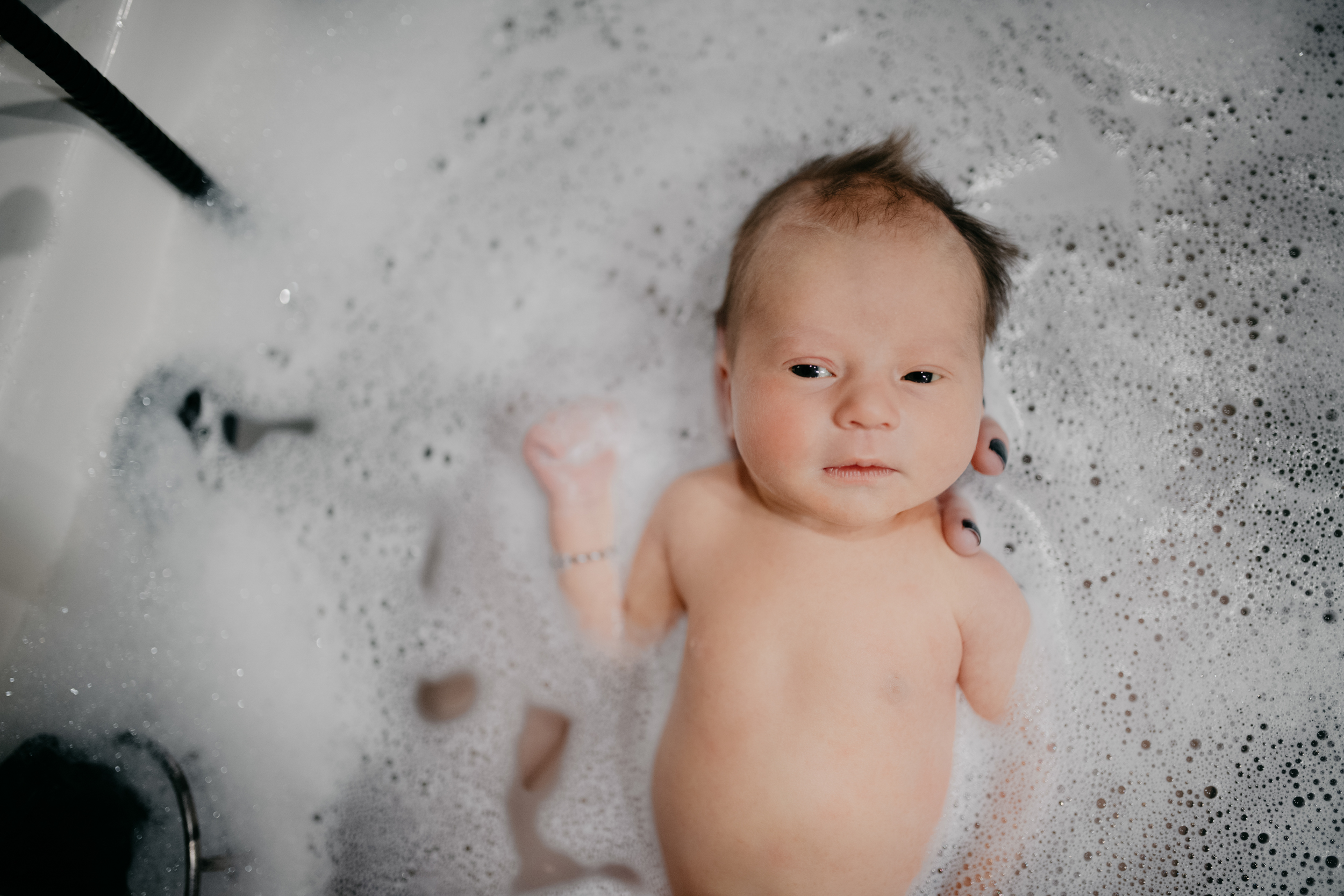 Baby girl in bubble bath