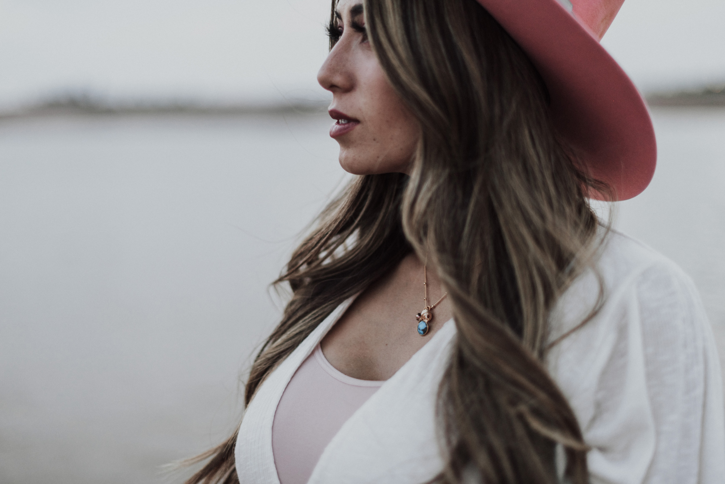 Pregnant mom wearing pink cowboy hat turquoise necklace Lady War Bonnets