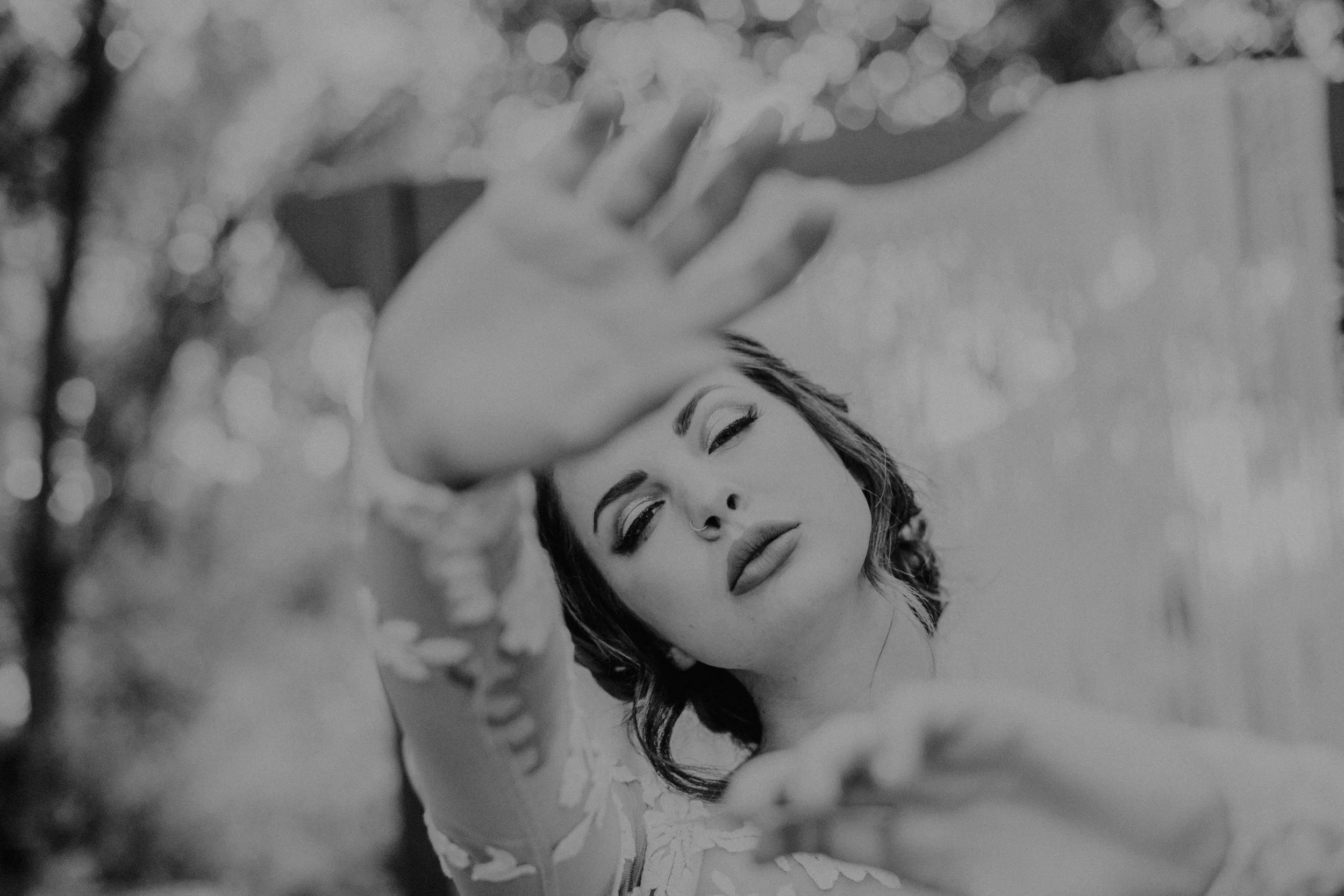 Bride in lace dress in front of macrame