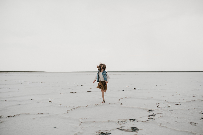 little girl running towards camera on the bonneville saltflats 