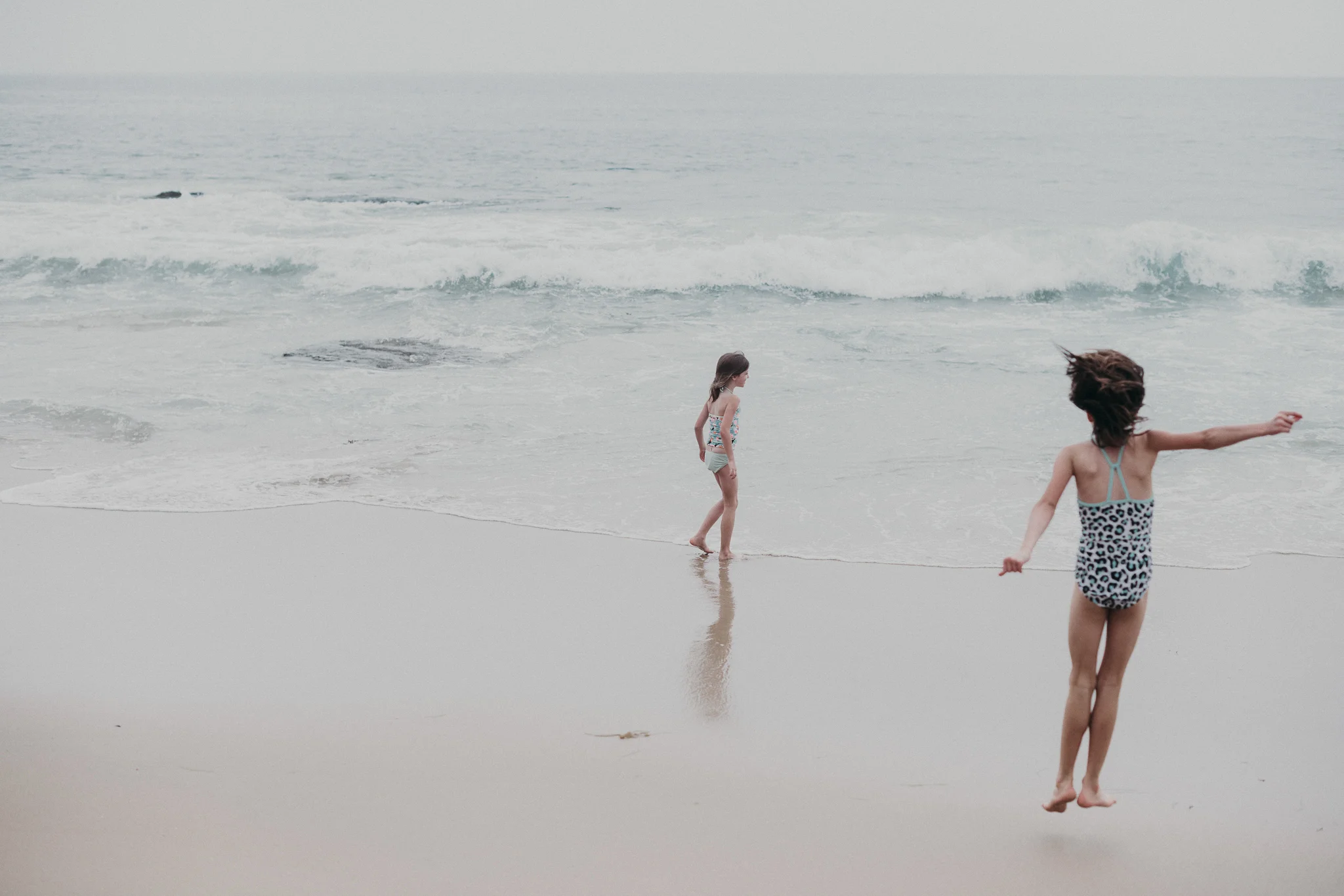 Little girls playing on the beach in California