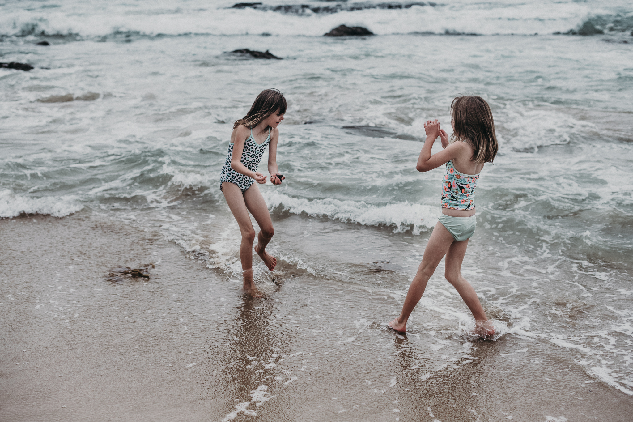 Young girls playing in shallow water