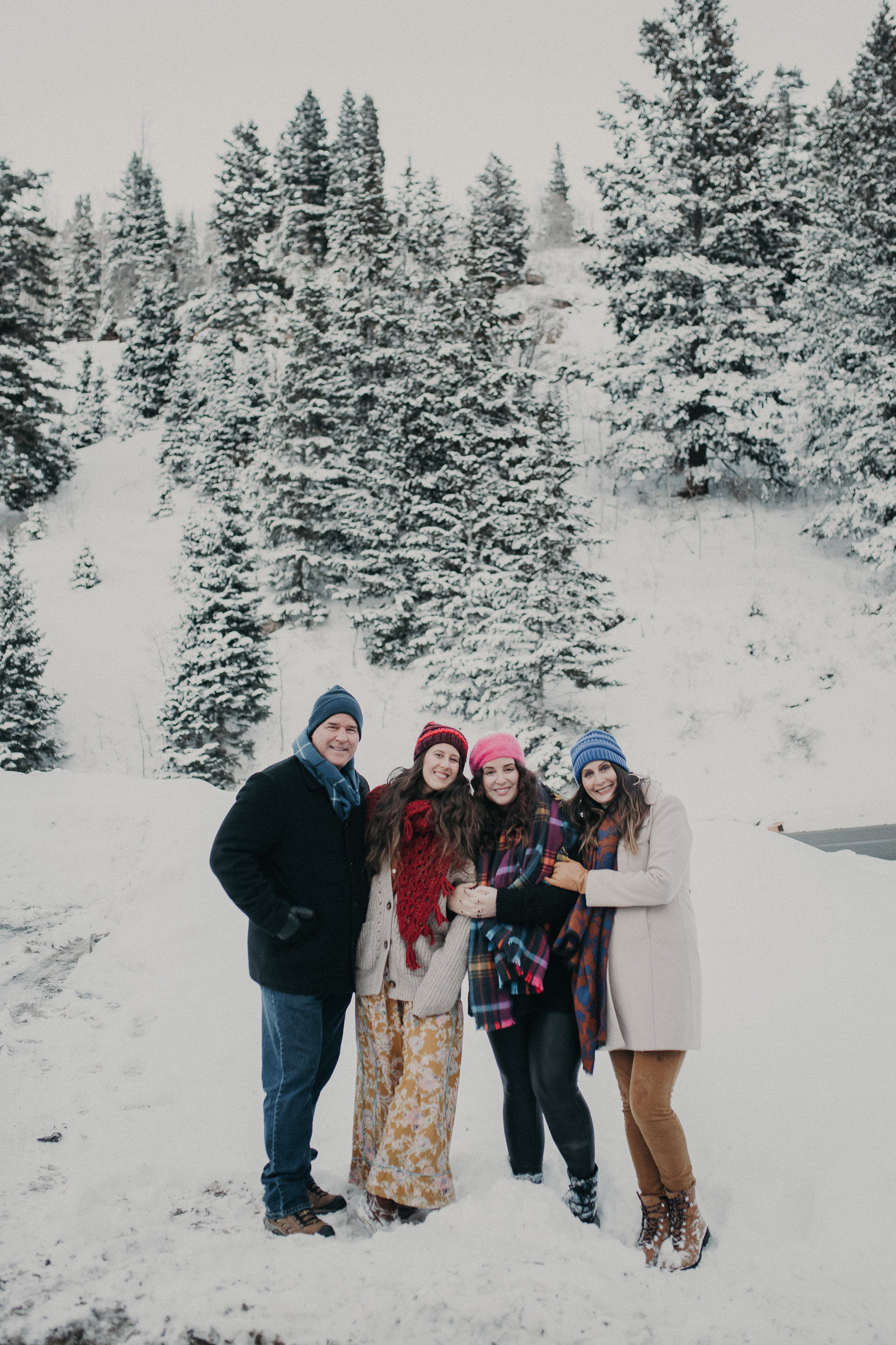Extended family in snowy mountains 