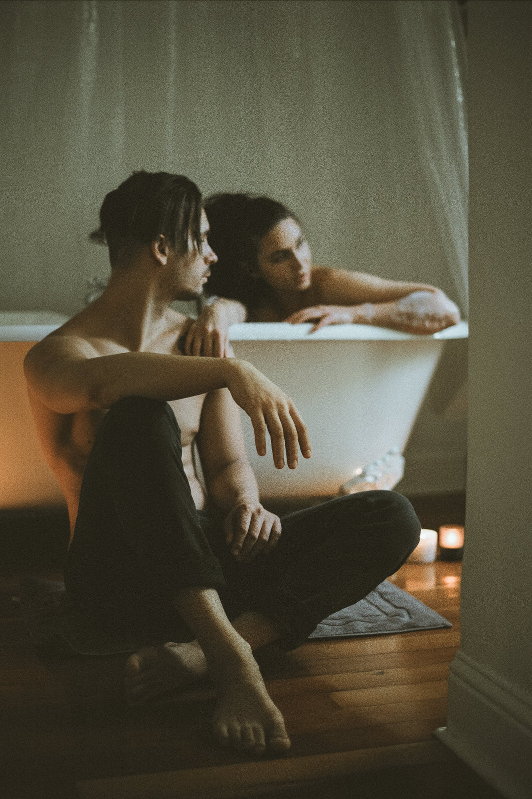 couple in bathtub with vintage hard wood floors